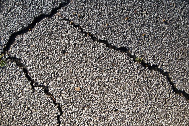 Cracked asphalt Cherokee Nation federal transportation compact
